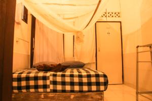 Postel nebo postele na pokoji v ubytování Seabreeze Hostel Bali
