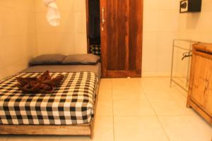 Postel nebo postele na pokoji v ubytování Seabreeze Hostel Bali
