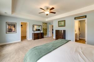 a bedroom with a bed and a ceiling fan at Holly Ridge Vacation Rental about 5 Mi to Beach in Holly Ridge
