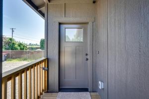 a front door of a house with a window at Bright Central Point Home with Deck and Mountain Views in Central Point