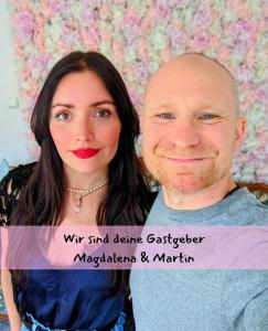 a woman and a man posing for a picture at Queen Apartment in Uelzen