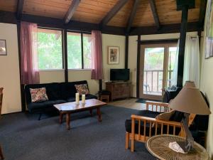 a living room with a couch and a table at Rustridge Ranch & Winery in St. Helena