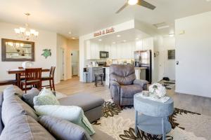 a living room and kitchen with a couch and a table at Mesquite Vacation Rental Condo with Resort Amenities in Mesquite