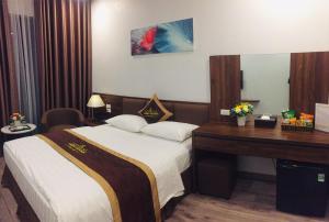 Postel nebo postele na pokoji v ubytování Minh Thanh Villa Hotel - Hà Đông,Hà Nội