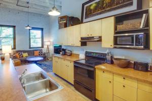 a kitchen with a sink and a stove top oven at Pet-Friendly Billings Vacation Rental in Downtown! in Billings