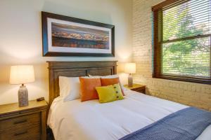 a bedroom with a bed and a picture on the wall at Pet-Friendly Billings Vacation Rental in Downtown! in Billings