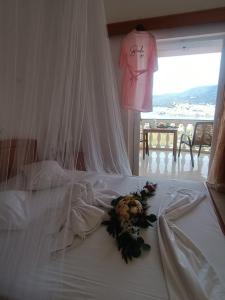 Postel nebo postele na pokoji v ubytování Poros View