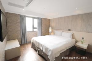 Postel nebo postele na pokoji v ubytování Talmud Hotel Yizhong