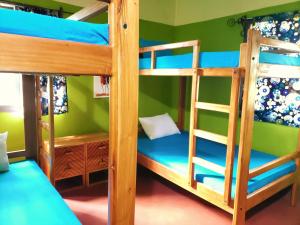 a bunk bed room with two bunk beds at Hostel Kiliwood in Moshi