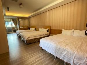 Letto o letti in una camera di Dragon Manor Resort