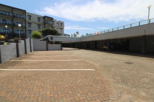 an empty parking lot next to a building at Seagull 303 in Margate
