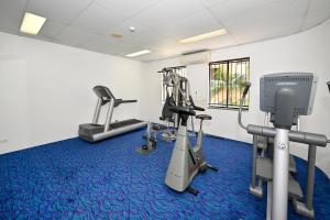 a gym with treadmills and exercise equipment in a room at Mooloolaba 2 B/R Getaway - Perfect location ZD5 in Mooloolaba