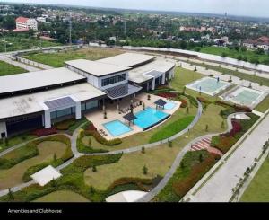 an aerial view of a large building with a swimming pool at Condo Unit at Cool Suites SMDC Wind Tagaytay in Tagaytay