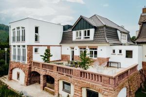 an aerial view of a house with a brick bridge at Mainterrasse Panorama Apartments in Miltenberg
