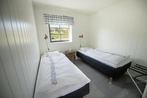 Postel nebo postele na pokoji v ubytování Waterfront Fishermen's Cottages
