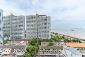 an aerial view of tall buildings and the beach at Aeras beachfront 1 bedroom in Jomtien Beach