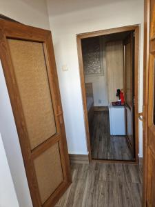 an open door in a room with a hallway at Casa Dadi in Constanţa