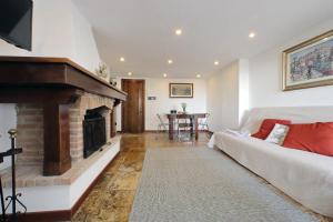 a living room with a couch and a fireplace at Super Attico con terrazza Lodi in Rome