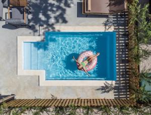 an overhead view of a swimming pool with a life preserver at Polidor Camping Resort in Poreč +37 photos