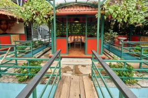 a restaurant with a table and chairs in a building at Vidya Residency in Trichūr