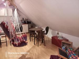 a living room with a hammock in a attic at Um Burebierg apartment 35m2 in Buschrodt
