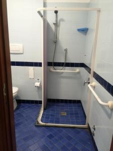 a bathroom with a shower and a toilet at Residence Oltremare in San Benedetto del Tronto