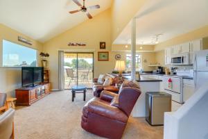 a living room with a couch and a table and a kitchen at Prescott Home with Views - Pets Welcome! in Prescott