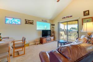 a living room with a couch and a flat screen tv at Prescott Home with Views - Pets Welcome! in Prescott