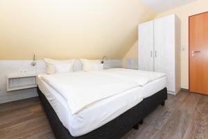 Postel nebo postele na pokoji v ubytování Pension Nordkap