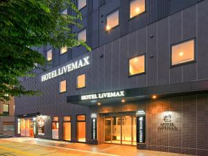 a facade of a building with a hotel lobby at Hotel Livemax Premium Nagano Ekimae in Nagano