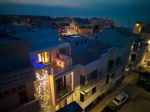 an aerial view of a building at night at White Coast in Polignano a Mare