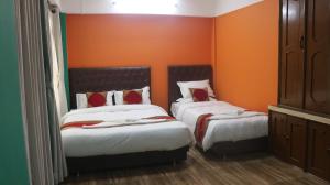 Voodi või voodid majutusasutuse Nepalaya Home Hostel toas
