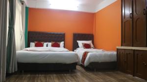 Voodi või voodid majutusasutuse Nepalaya Home Hostel toas