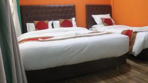 Voodi või voodid majutusasutuse Nepalaya Home Hostel toas