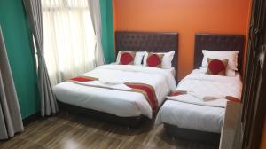Voodi või voodid majutusasutuse Nepalaya Home Hostel toas