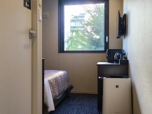 Postel nebo postele na pokoji v ubytování Hotel Livemax Premium Nagano Ekimae + 20 fotografií