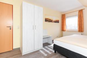 Postel nebo postele na pokoji v ubytování Pension Nordkap