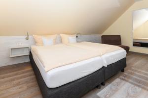 Postel nebo postele na pokoji v ubytování Pension Nordkap