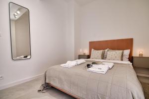 a bedroom with a large bed with a large mirror at Black Goat 81 Apartaments in Zator