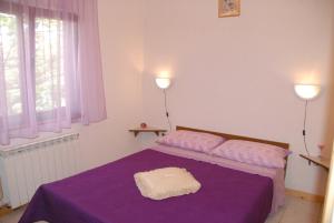 Postel nebo postele na pokoji v ubytování Mon Perin Castrum - Studio Apartment Adriano