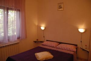 Postel nebo postele na pokoji v ubytování Mon Perin Castrum - Studio Apartment Adriano
