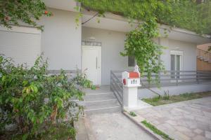 a bird house in front of a house at Studios 21 in Nydri