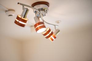 a group of lights on a ceiling at Residence Hotel Hakata 8 in Fukuoka