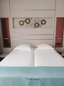 Postel nebo postele na pokoji v ubytování Hotel Coroana