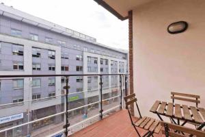 a balcony with a bench and a large building at Luxury Two Bedroom Apt in Dublin in Dublin
