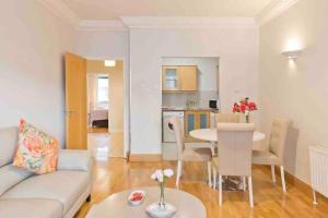 a living room with a couch and a table at Luxury Two Bedroom Apt in Dublin in Dublin