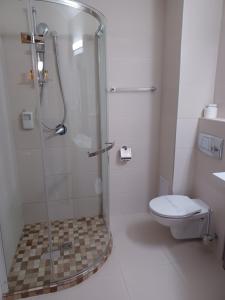 Koupelna v ubytování Hotel Coroana
