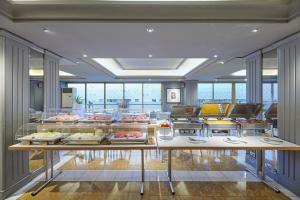 a room with a buffet of food on display at Hotel Plaza in Mestre