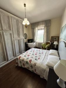 a bedroom with a large bed and a window at Contrada Cafaro in Salerno