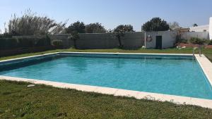 a large swimming pool in a yard with a yard at Casas Miramar in Tarifa